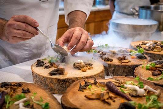 A spread of prepared dishes arranged on a catering table, illustrating the kind of shared-plate service typical of Space Coast graduation party catering.