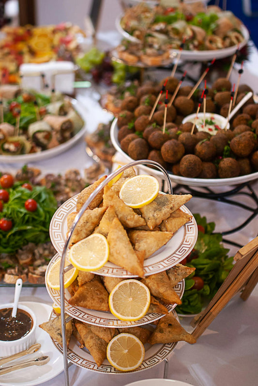 Elegantly arranged buffet of warm chafing dishes ready to serve at a corporate event, illustrating the quality of professionally catered Space Coast business gatherings.